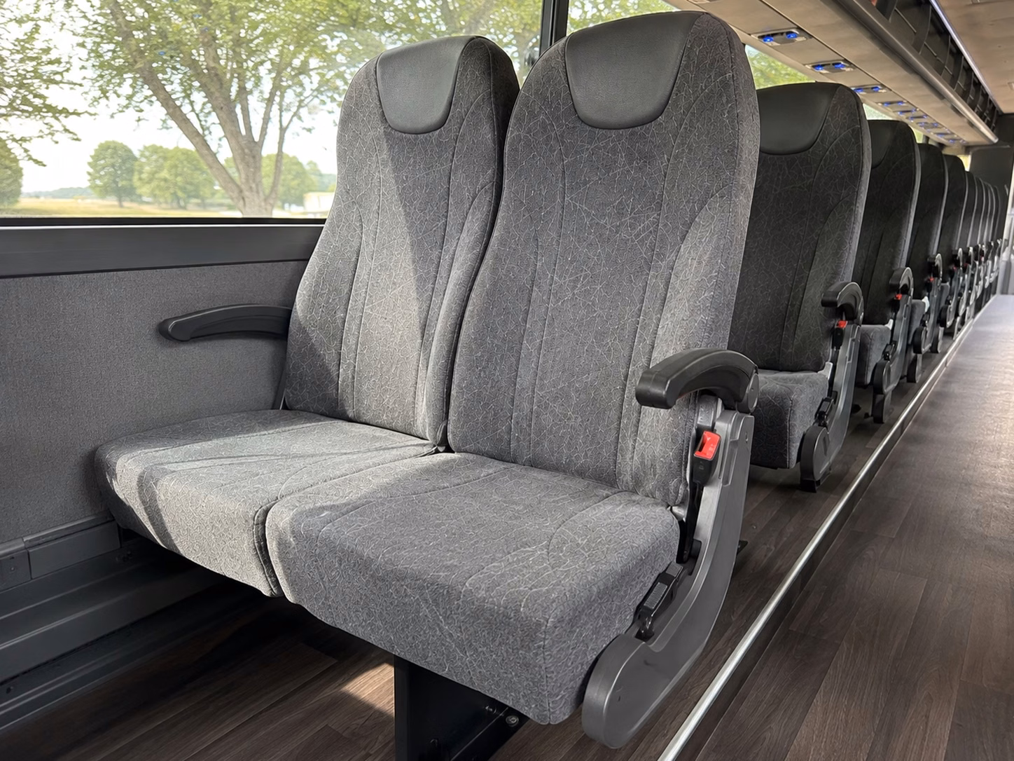 instead of splitting your wedding party into rideshares keep everyone together on one bus
